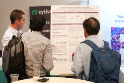 Showcase Your Research: This image shows three professionals studying a scientific poster